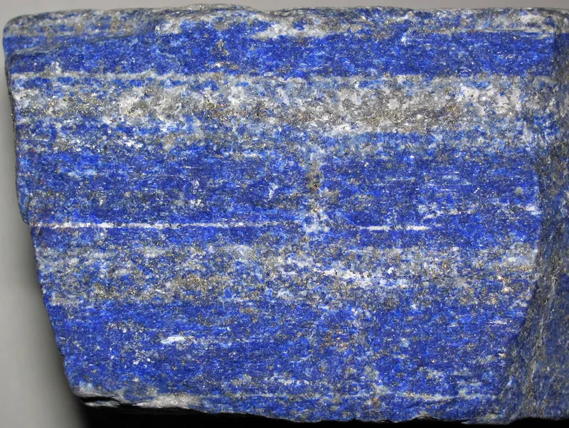 Lapis lazuli from the Sar-e-Sang deposit in Afghanistan: deep blue lazurite with white calcite and flecks of gold-colored pyrite